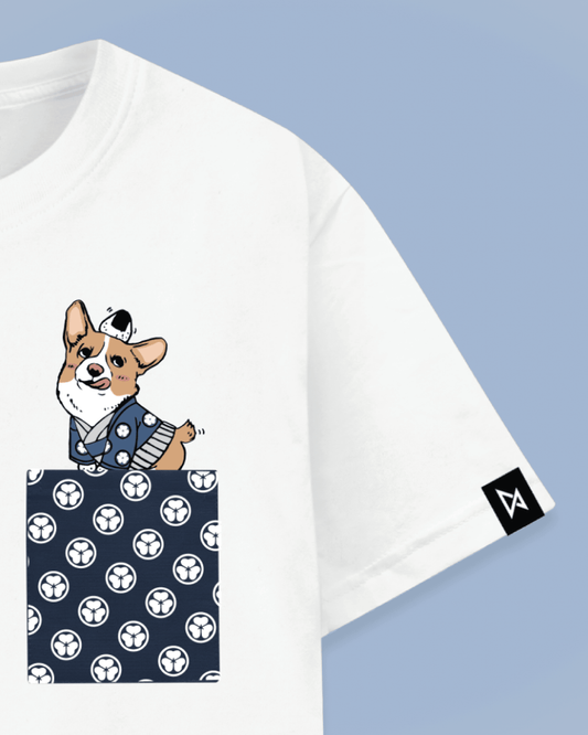 Datclothing - Print view - White t-shirt with blue pocket and Welsh Corgi balancing an Japanese snack onigiri print