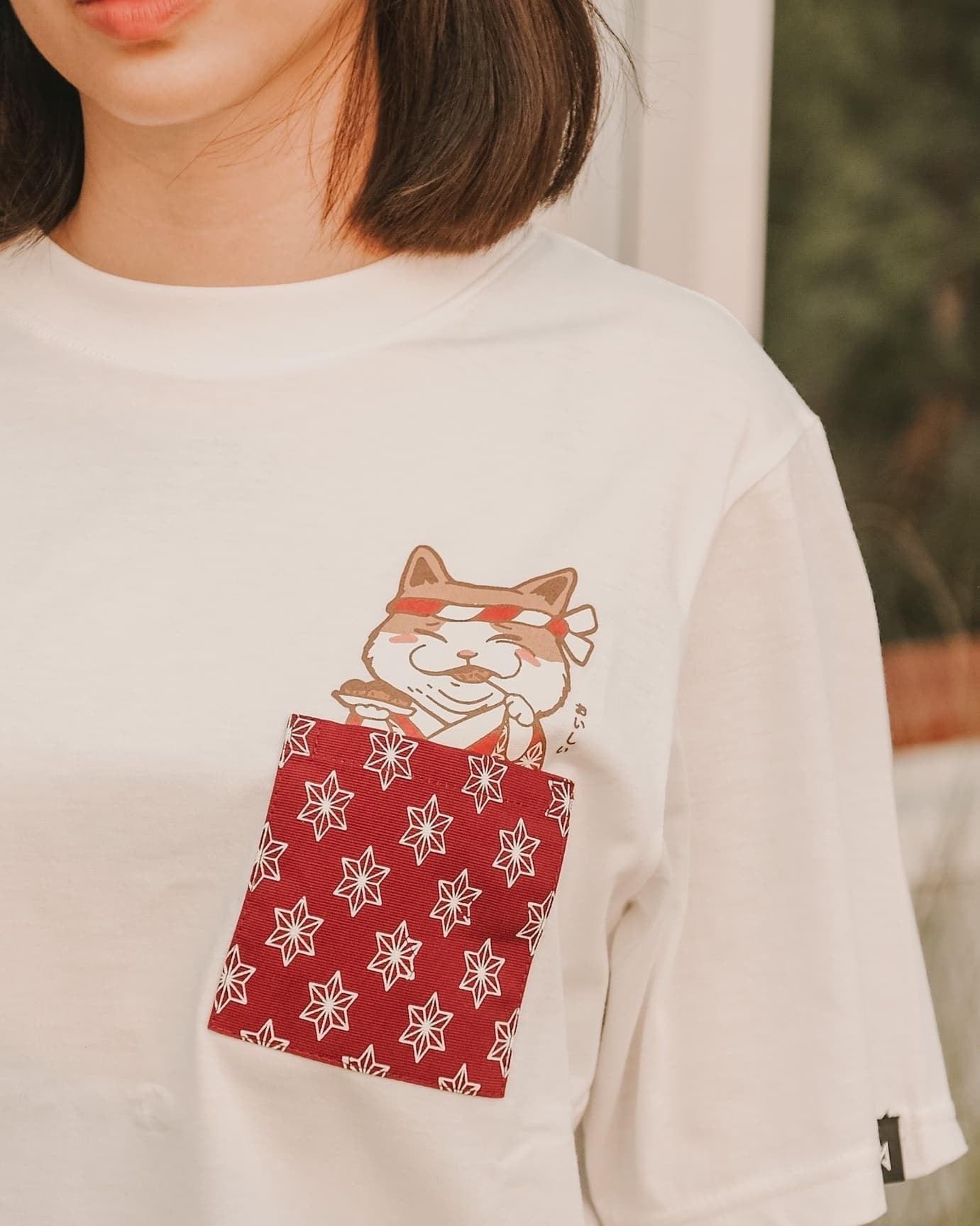 Datclothing - Women wearing white T-Shirt with Takoyaki Neko (cat) print and pocket